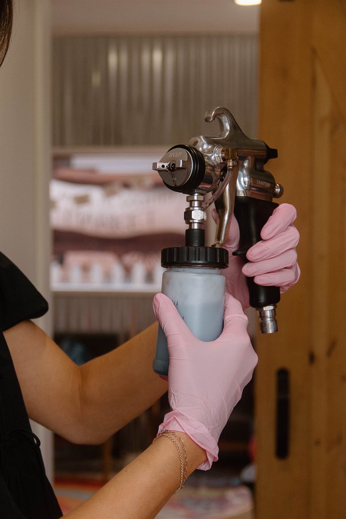 Spray tan equipment at the Tanned By Ky studio